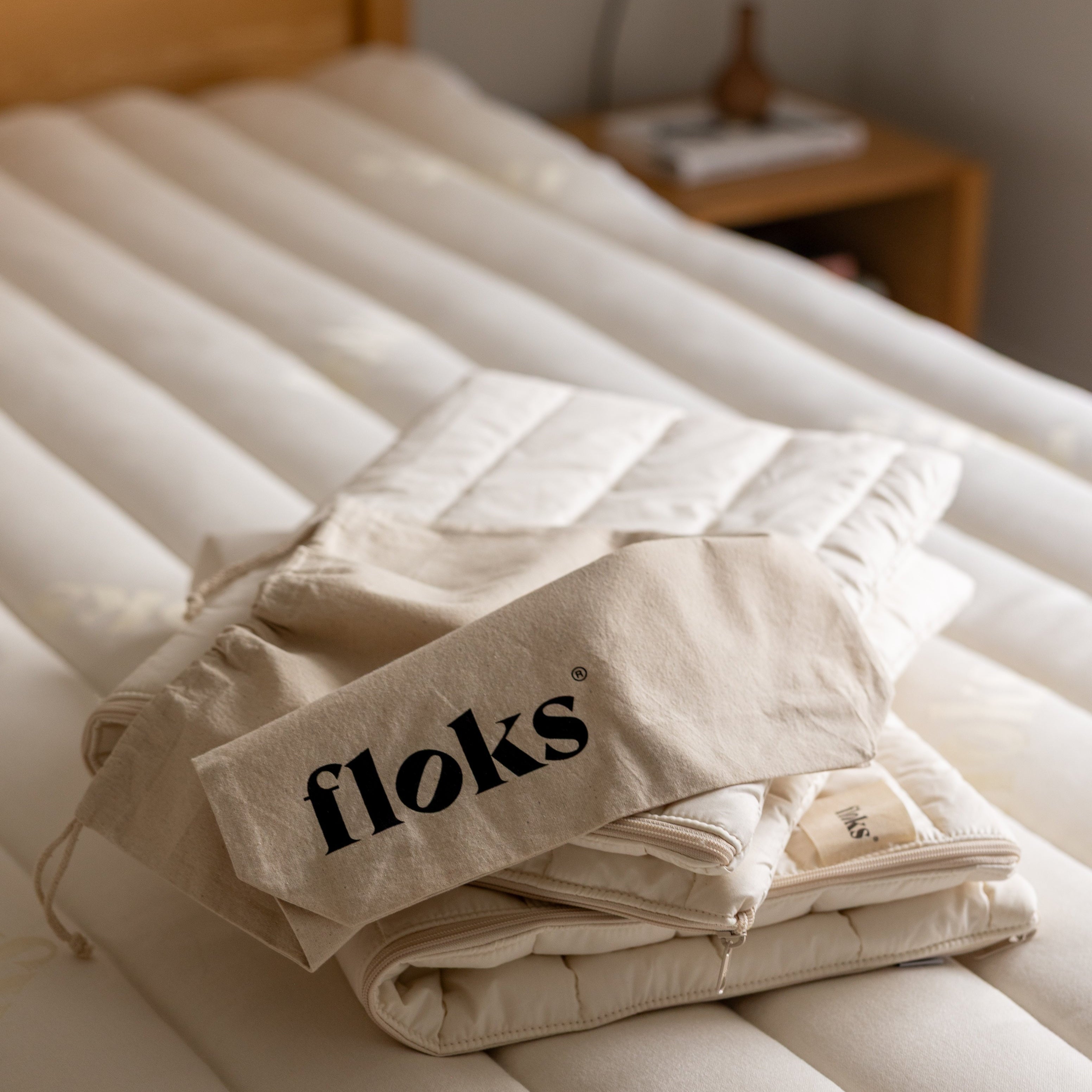 Floks quilted wool pillow cases on a bed