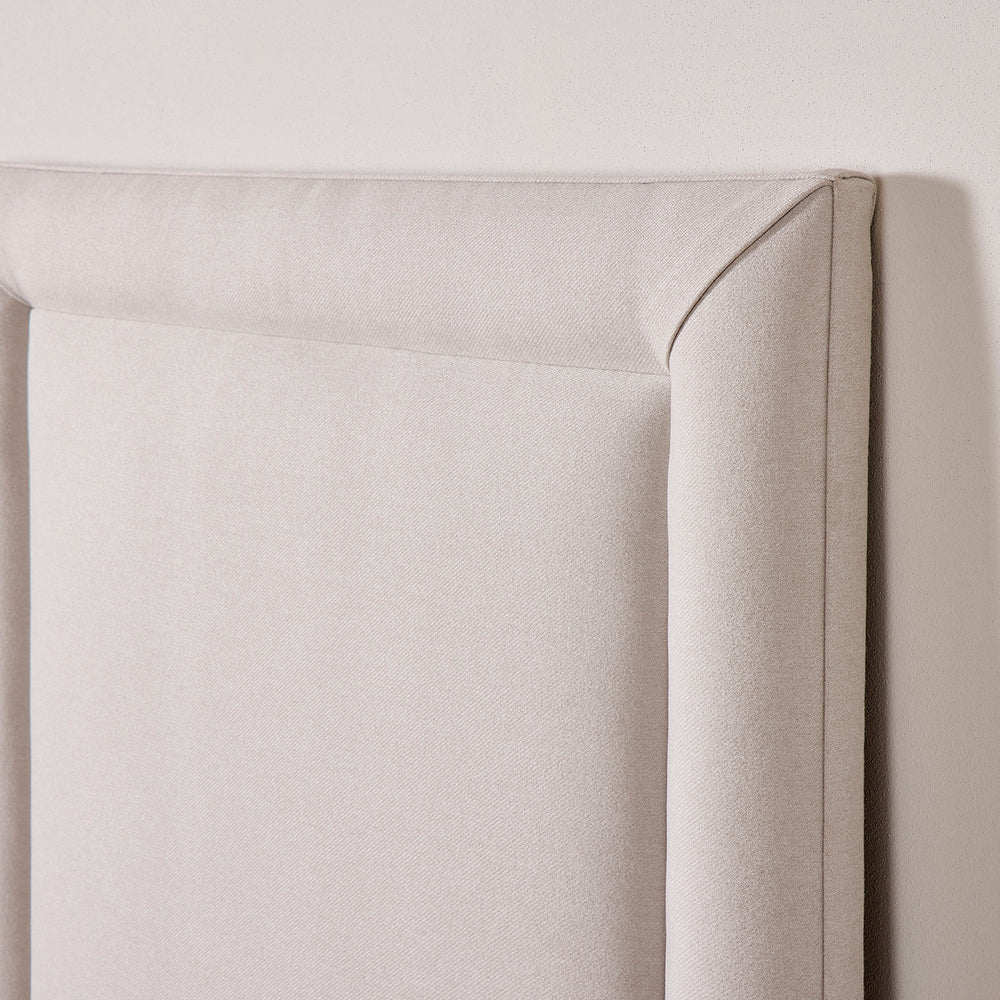 Floks Reykjavik upholstered headboard shown in full close up detail.  Smooth curved lines create a luxurious look.