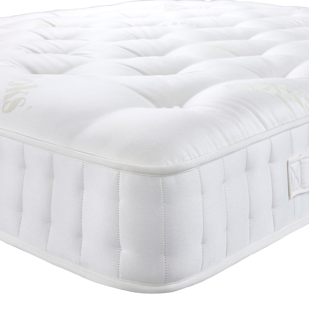 Floks Away Mattress detailing the corner with a white background