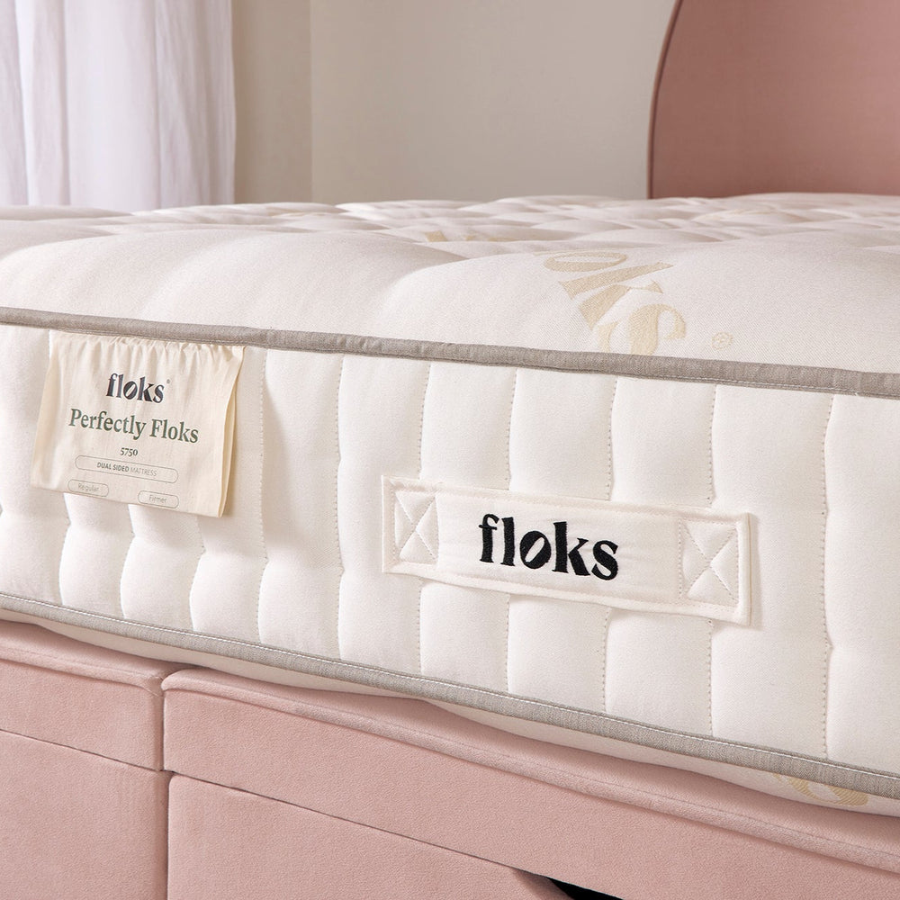 Perfectly Floks 5750 Mattress made from UK-certified wool and pocket springs, offering a cooling, supportive, and breathable sleep solution designed to transform the way you rest. Close up image of the mattress on top of The Emily ottoman bed. 