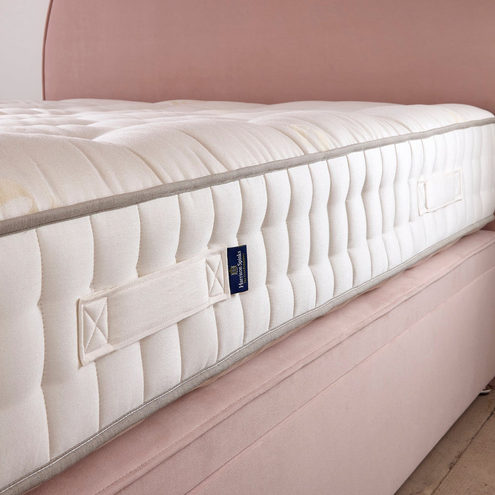 Perfectly Floks 5750 Mattress made from UK-certified wool and pocket springs, offering a cooling, supportive, and breathable sleep solution designed to transform the way you rest. Side image of the mattress on top of The Emily ottoman bed. 