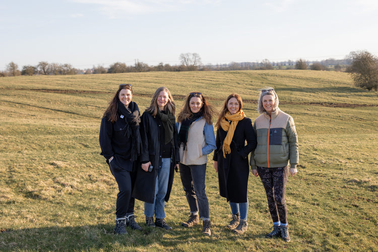 team Floks standing in a field