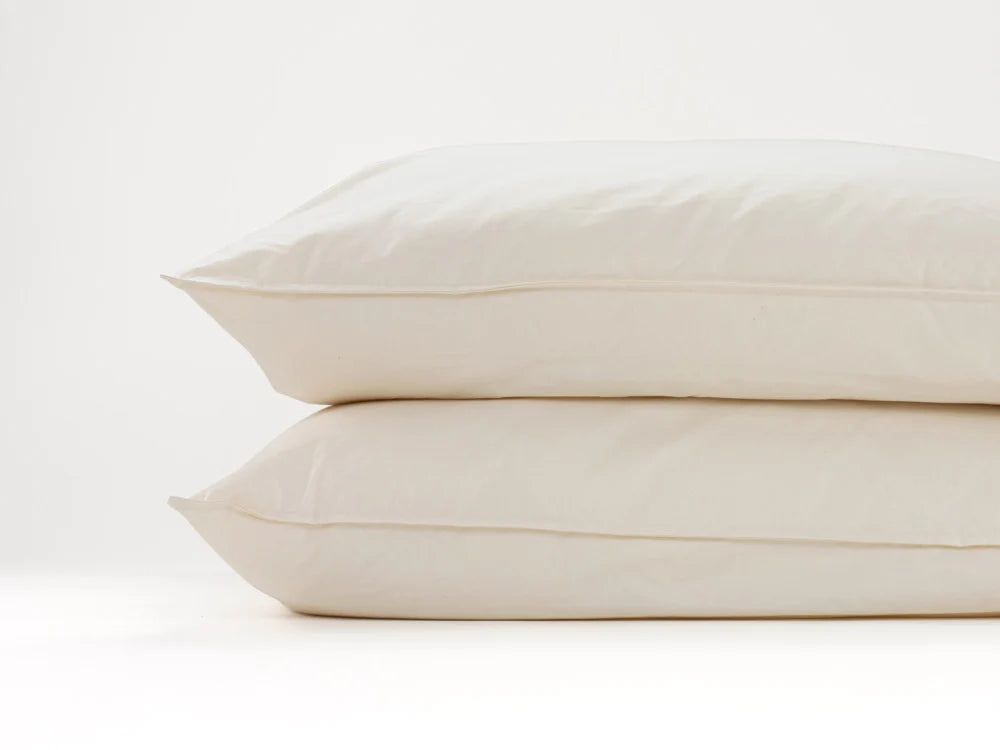 Stacked pair of wool pillows